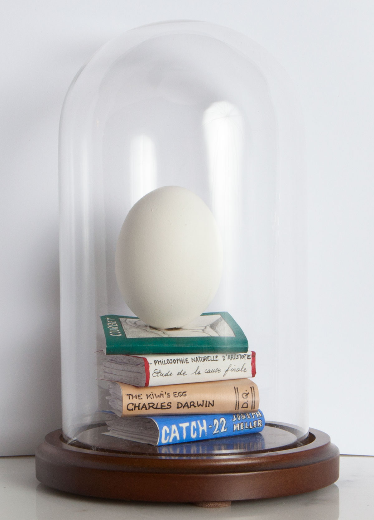 I came first, 2010, eggshell, paper, paint in glass dome, 17x10x10cm rel=